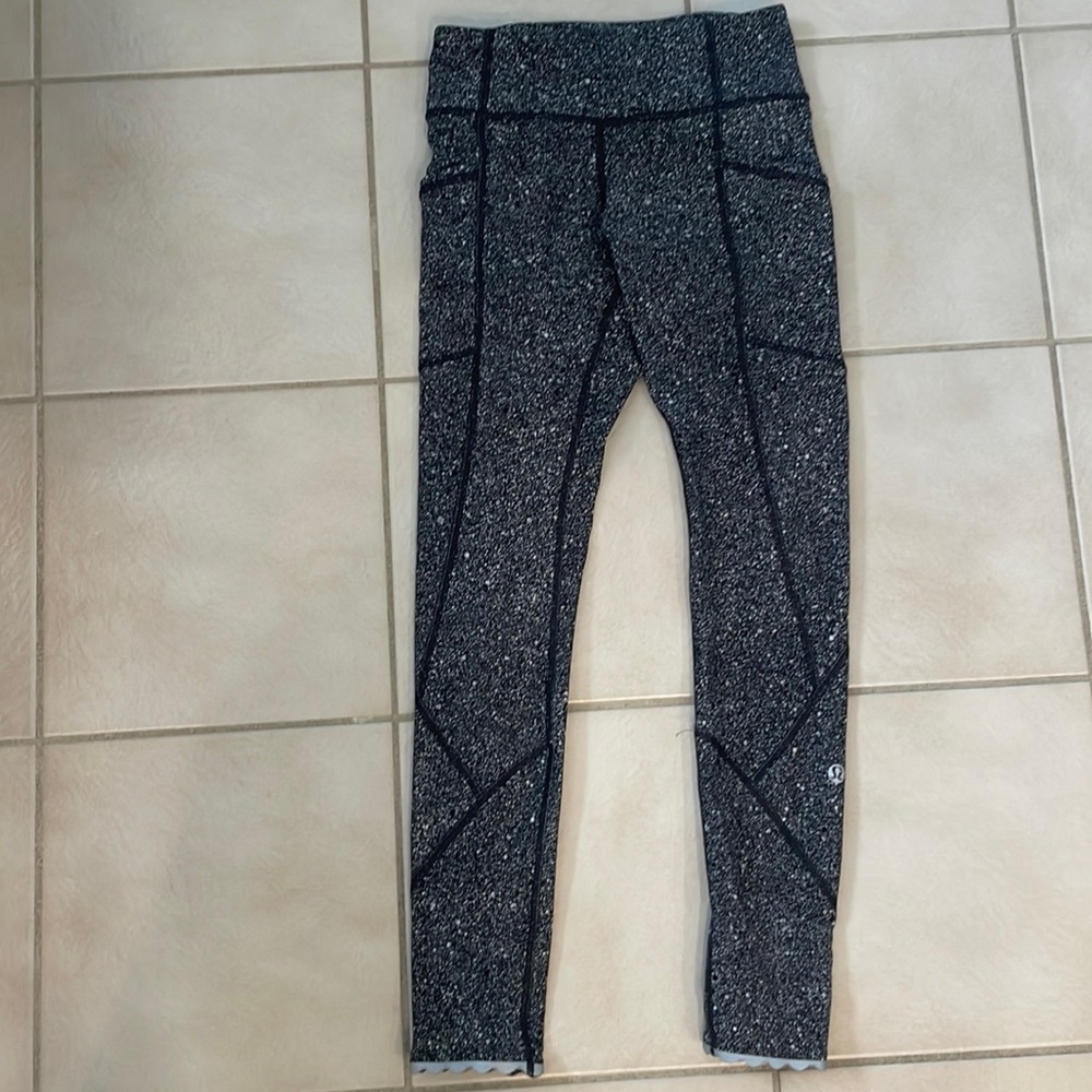 Like new Lululemon grey and white and black leggings. Size 2